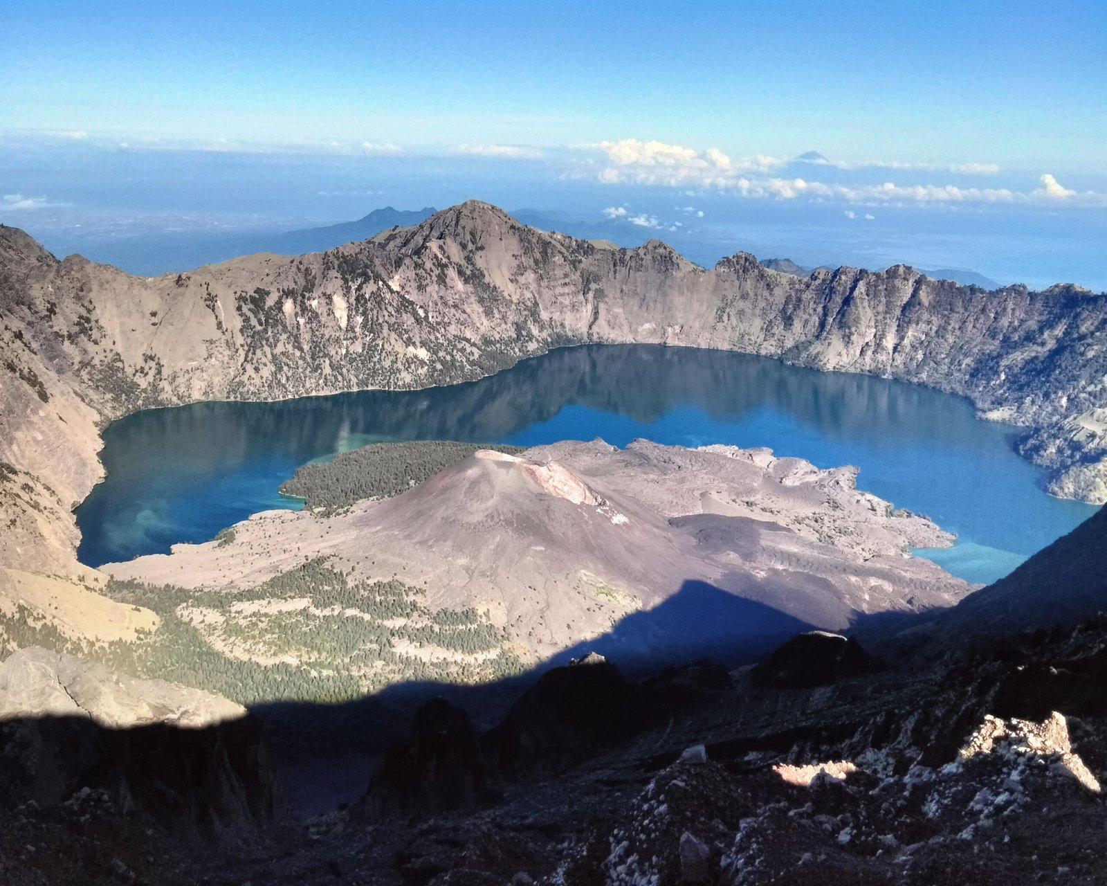 Group of hikers enjoying Rinjani trekking package, exploring scenic landscapes and natural beauty during the trekking adventure